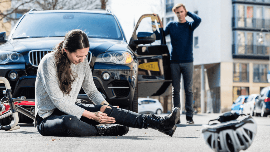 a girl is injured in the road.
