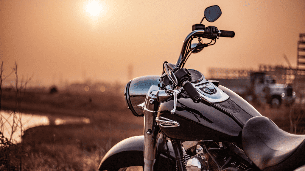 Motorcycle with a sunset behind it
